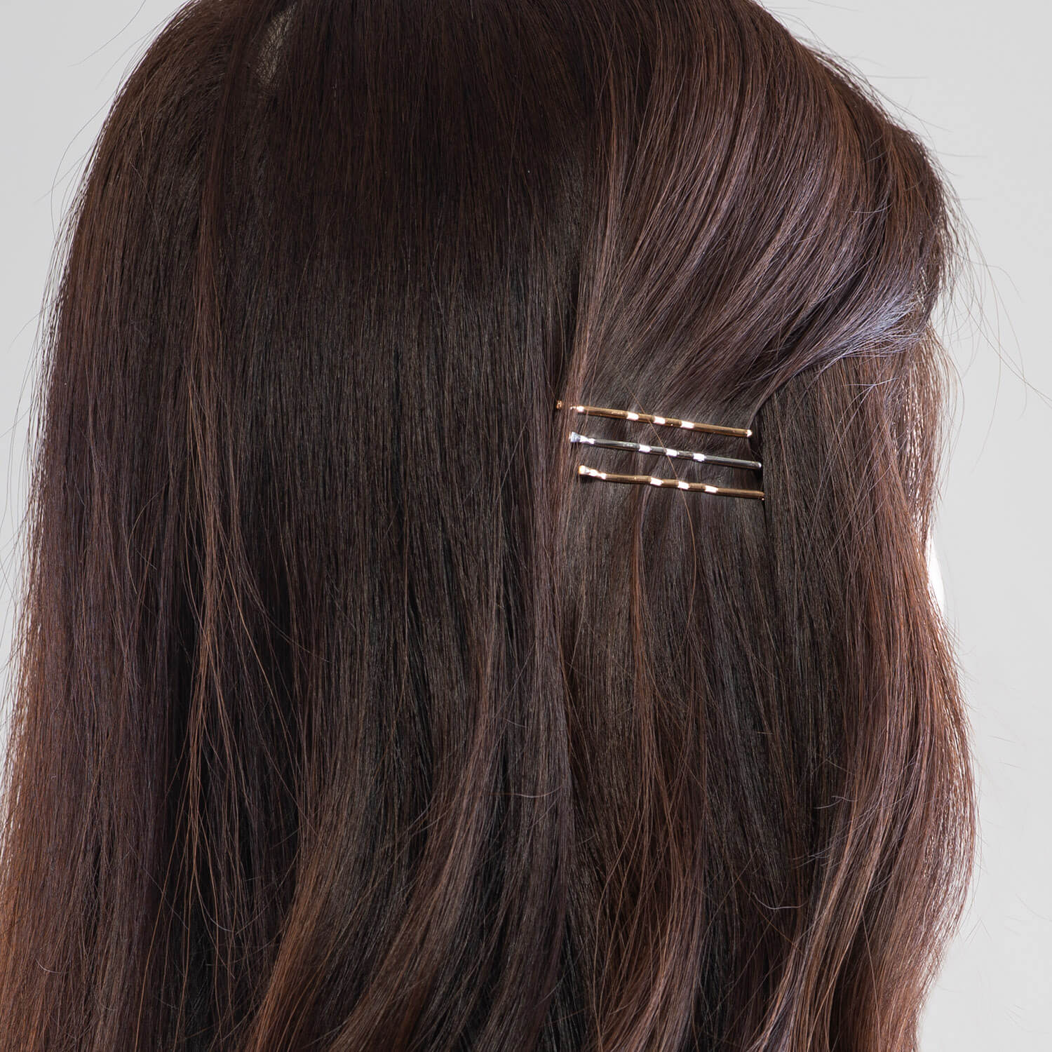 Cute bobby pins in brunette's hair